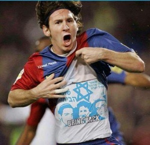 lionel-messi-with-kidnapped-kids-shirt.jpg